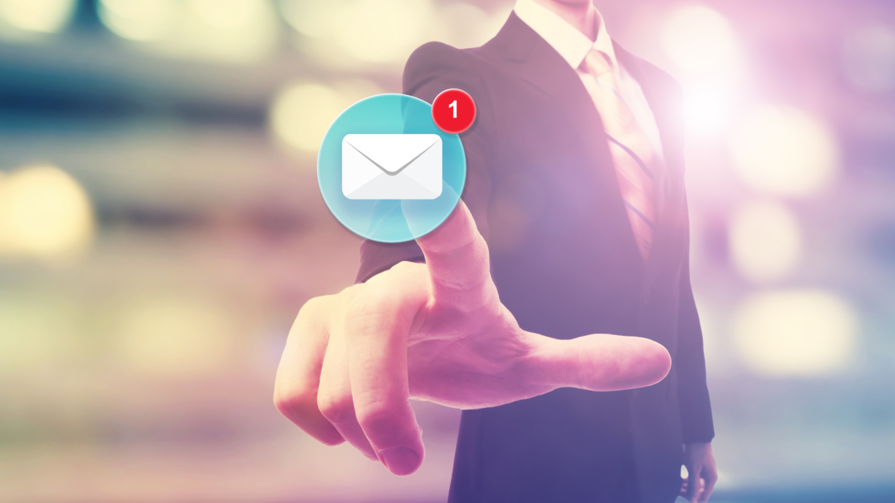 An image of a business person touch an email icon