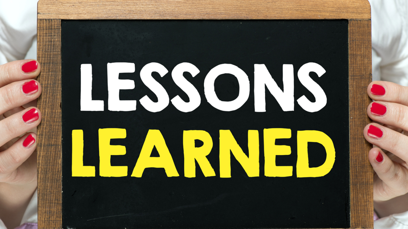 Lessons Learned written on a chalk board